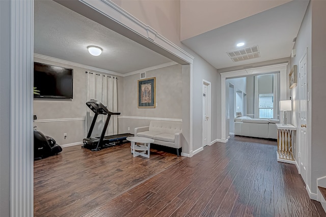 exercise room featuring dark hardwood / wood-style floors