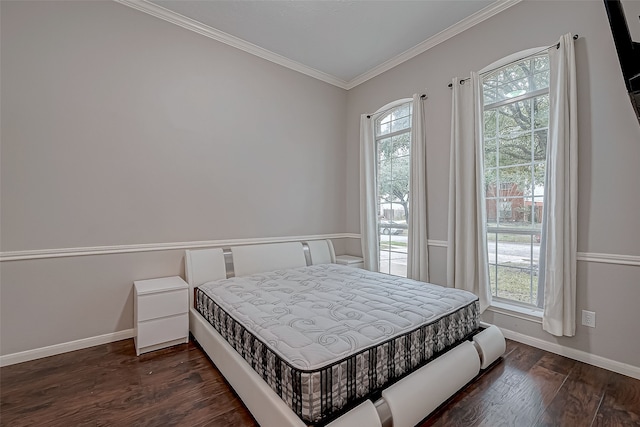 bedroom featuring dark wood-type flooring and ornamental molding