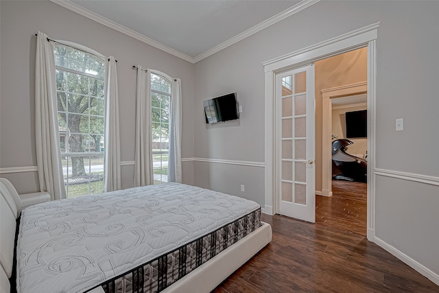 bedroom with dark wood-type flooring and ornamental molding