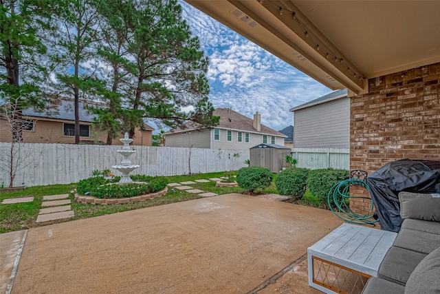 view of patio / terrace featuring a shed