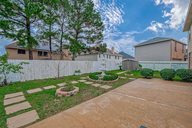 view of yard with a patio and a shed