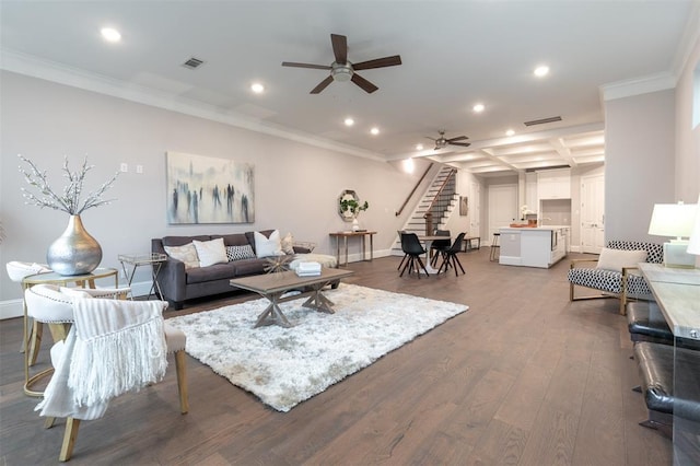 living room with ceiling fan, ornamental molding, coffered ceiling, and hardwood / wood-style flooring