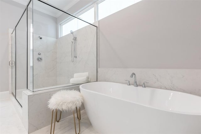 bathroom featuring separate shower and tub