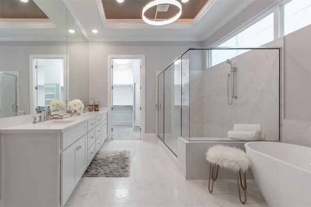 bathroom with a raised ceiling, crown molding, vanity, and plus walk in shower