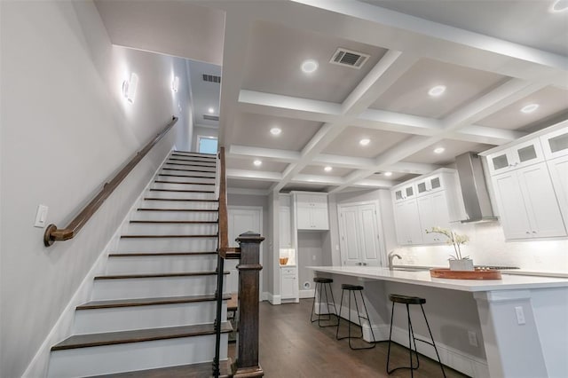 5636 Darling St, Houston, TX 77007 - stairs featuring coffered ceiling, recessed lighting, beam ceiling, and wood finished floors
