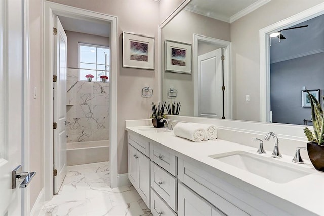 bathroom with crown molding, vanity, and washtub / shower combination