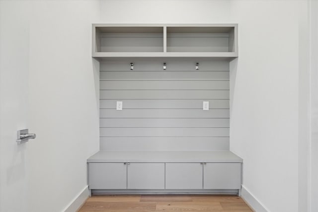 mudroom with light hardwood / wood-style floors