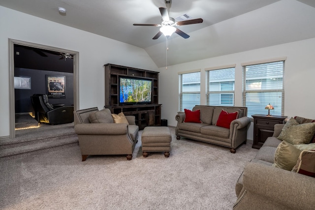 living room featuring light carpet, ceiling fan, vaulted ceiling, and a healthy amount of sunlight