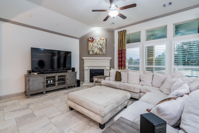 living room featuring ceiling fan, crown molding, and lofted ceiling