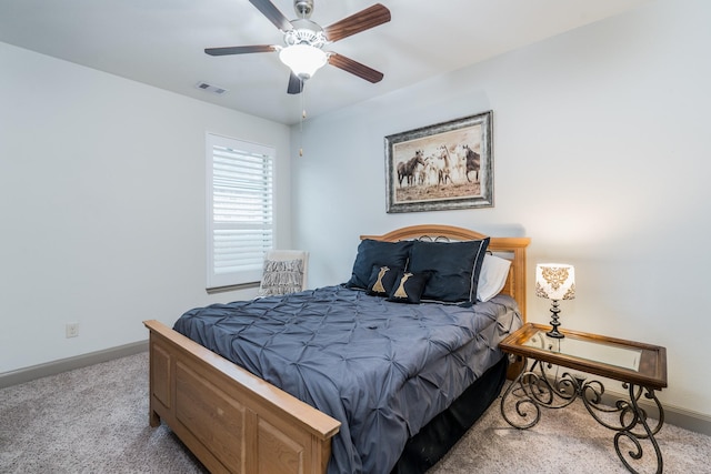 bedroom featuring ceiling fan and light colored carpet