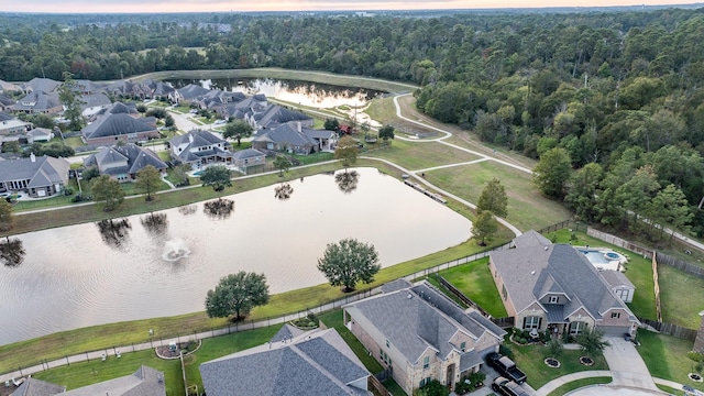 aerial view at dusk with a water view