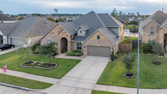 view of front of property with a front yard and a garage