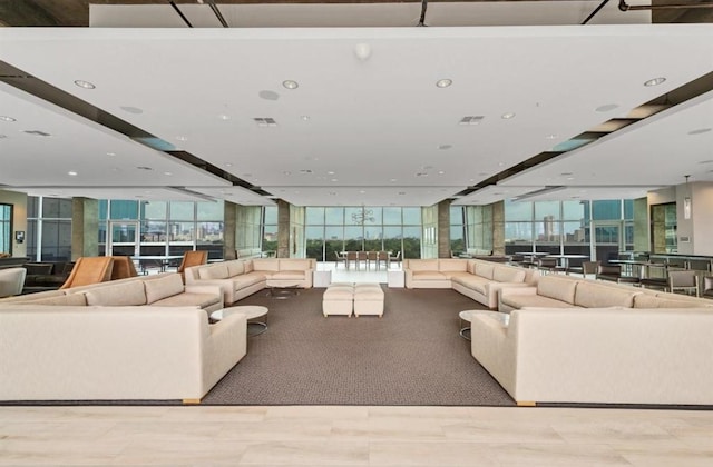 living room featuring a wall of windows