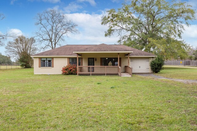 ranch-style house with a garage and a front yard