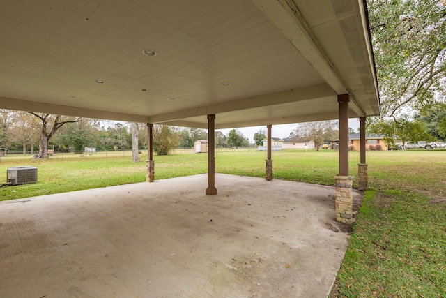 view of patio / terrace featuring a storage shed, an outdoor structure, and cooling unit