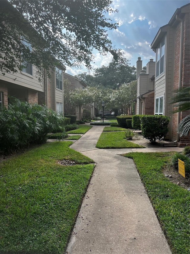 view of community featuring a yard