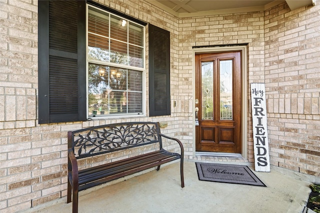 entrance to property featuring a porch