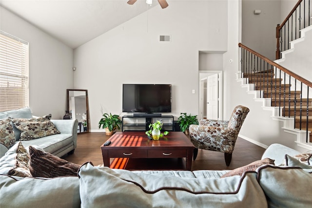 living room featuring ceiling fan, dark hardwood / wood-style floors, and vaulted ceiling