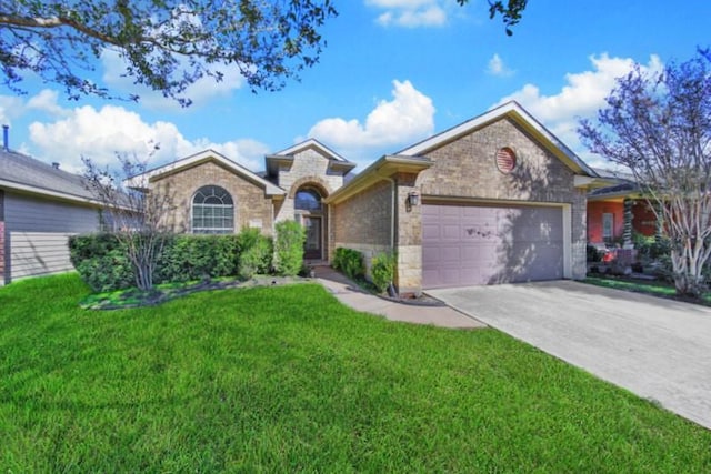 ranch-style home with a front lawn and a garage