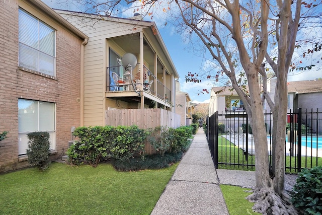 view of home's exterior with a yard