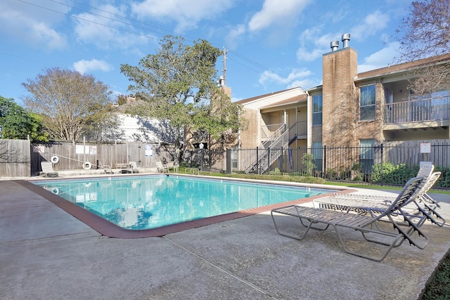 view of swimming pool with a patio