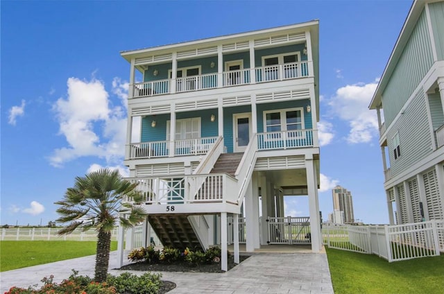 raised beach house with a balcony