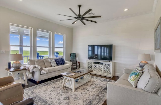 living room featuring hardwood / wood-style flooring, ceiling fan, and ornamental molding