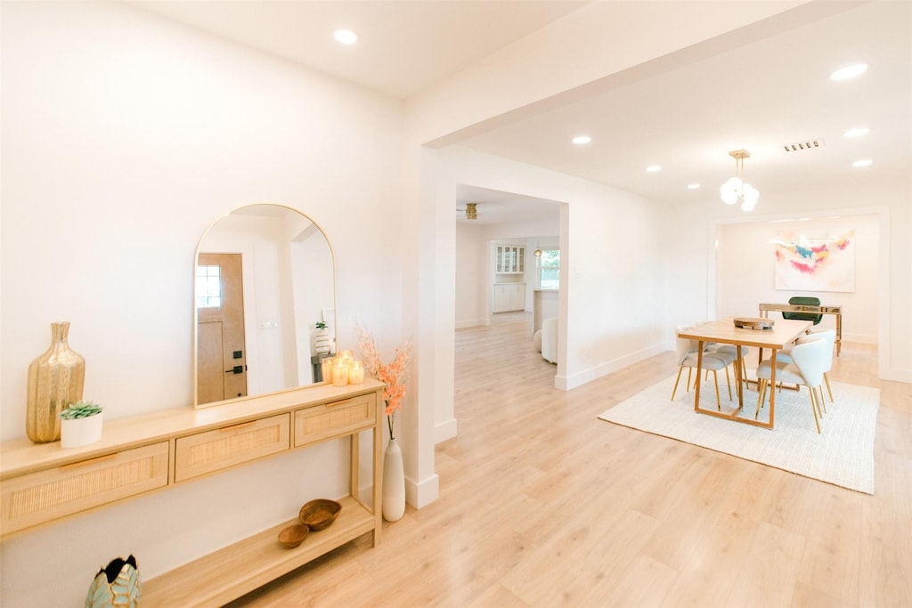 dining space with hardwood / wood-style flooring