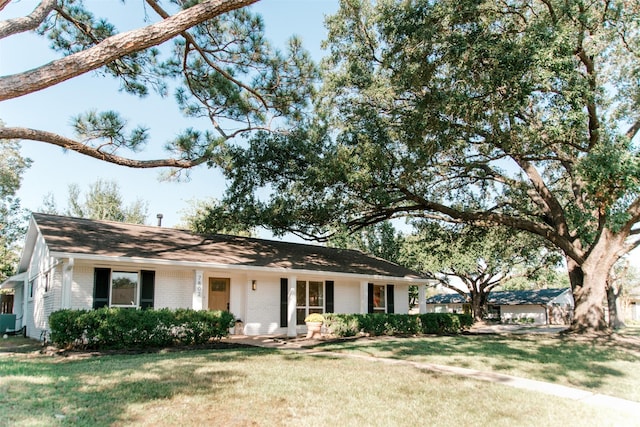 ranch-style house with a front lawn