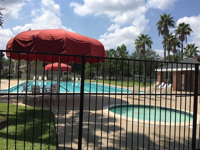 view of pool featuring a patio