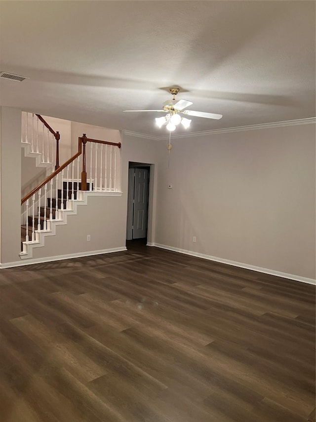 spare room featuring ceiling fan, dark hardwood / wood-style flooring, and ornamental molding