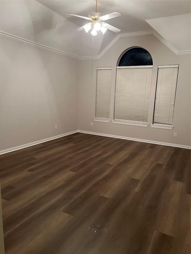 interior space with dark hardwood / wood-style floors, crown molding, ceiling fan, and lofted ceiling