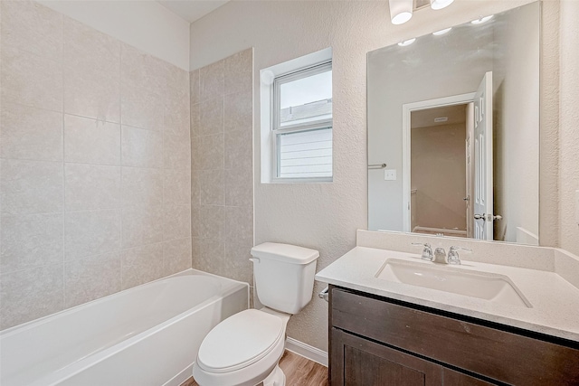 full bathroom featuring toilet, shower / bathtub combination, wood-type flooring, and vanity