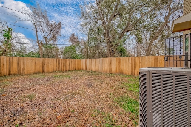 view of yard featuring central air condition unit