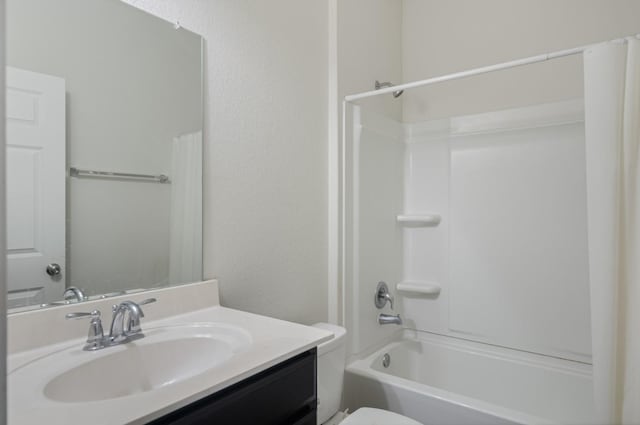 full bathroom with toilet, vanity, and shower / tub combo with curtain