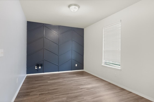 empty room featuring wood-type flooring