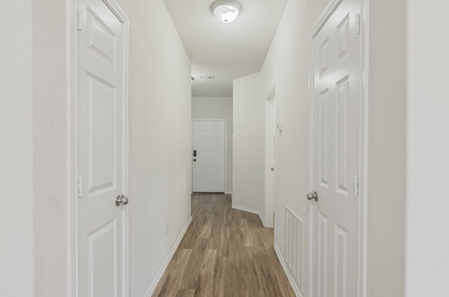 hall featuring light hardwood / wood-style floors