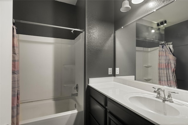 bathroom featuring vanity and shower / bath combination with curtain