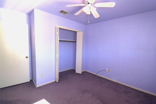 unfurnished bedroom with carpet flooring, ceiling fan, and a closet