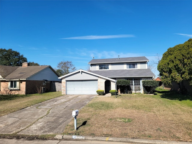 front facade with a garage and a front yard