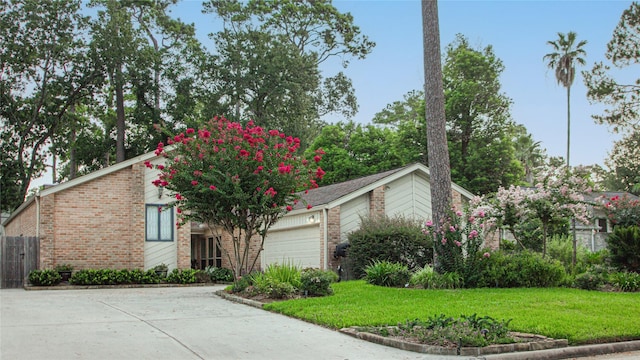 view of front facade with a front yard and a garage