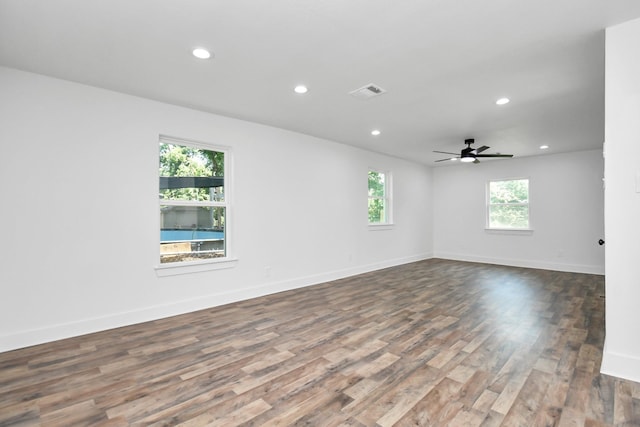 unfurnished room featuring dark hardwood / wood-style floors and ceiling fan