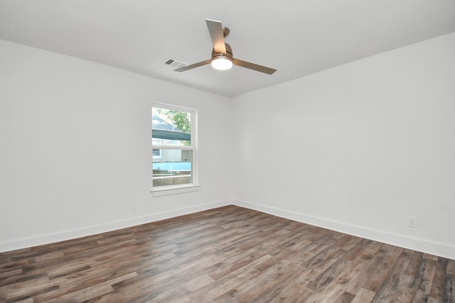 empty room featuring ceiling fan and hardwood / wood-style floors