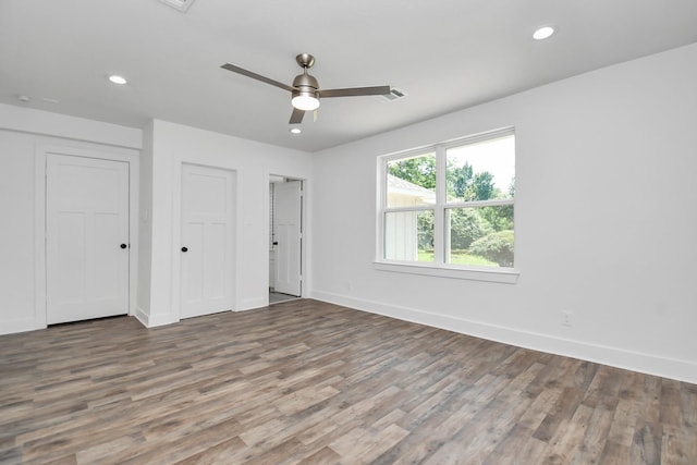 unfurnished bedroom with hardwood / wood-style floors and ceiling fan