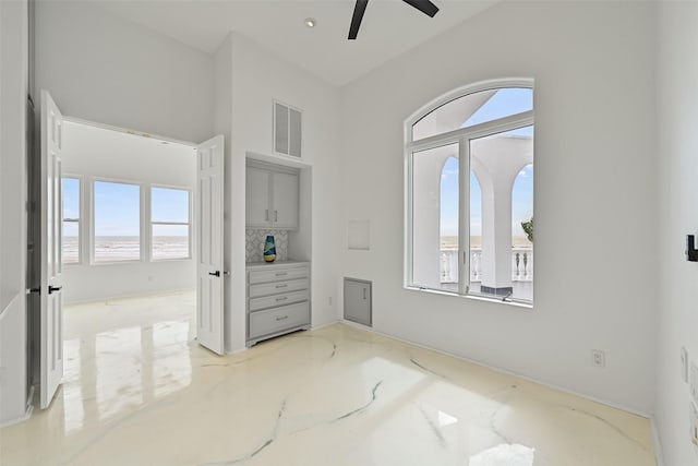 bedroom with visible vents and a ceiling fan