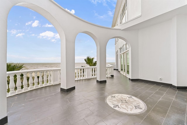 view of patio with a water view