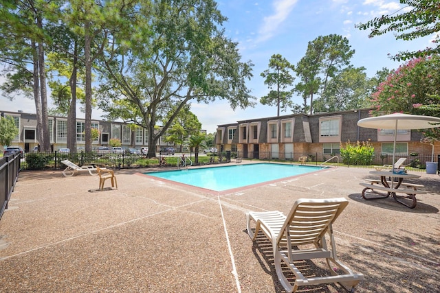 view of pool featuring a patio