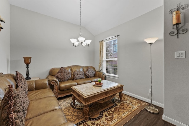 living room with an inviting chandelier, vaulted ceiling, and hardwood / wood-style flooring