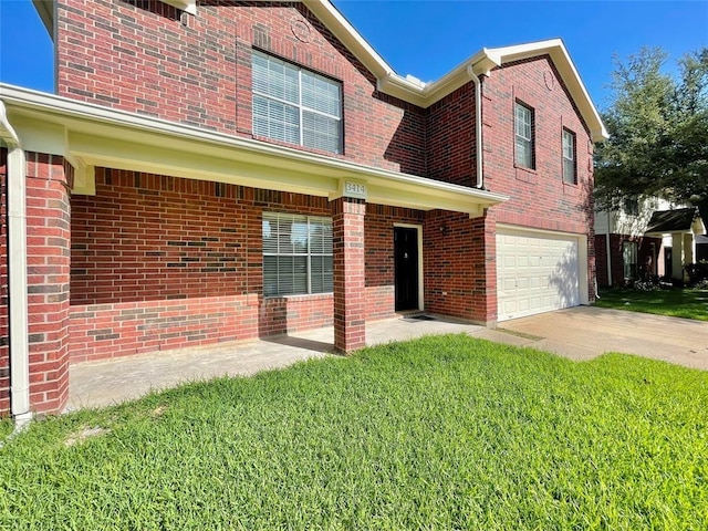 view of front of house featuring a garage and a front yard