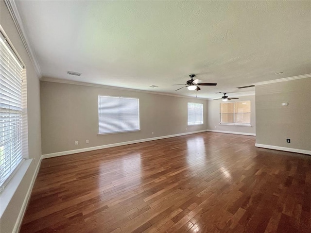 spare room featuring crown molding, ceiling fan, and dark hardwood / wood-style floors